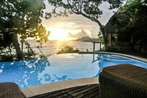 Beautiful sunset over the infinity pool at the Duavata villa at the Namale resort in Fiji