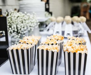 Batman kids' birthday party decor; cake, popcorn, and cake pops